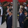 Chinese President Xi Jinping, center left and Zhang Shengmin, Vice Chairman of the Central Military Commission second from right attend a ceremony in honor of fallen national heroes at the Monument to the People's Heroes to mark Martyrs' Day at Tiananmen Square in Beijing, Wednesday, Sept. 30, 2026.