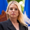 Attorney General Pam Bondi listens during a news conference at the Department of Justice, Wednesday, May 7, 2025, in Washington. In late April, the DOJ's Department of Justice Programs cancelled hundreds of public safety grants to local police and non-profits, leaving many to scramble to replace the funding. Many are appealing the cuts. (AP Photo/Alex Brandon)