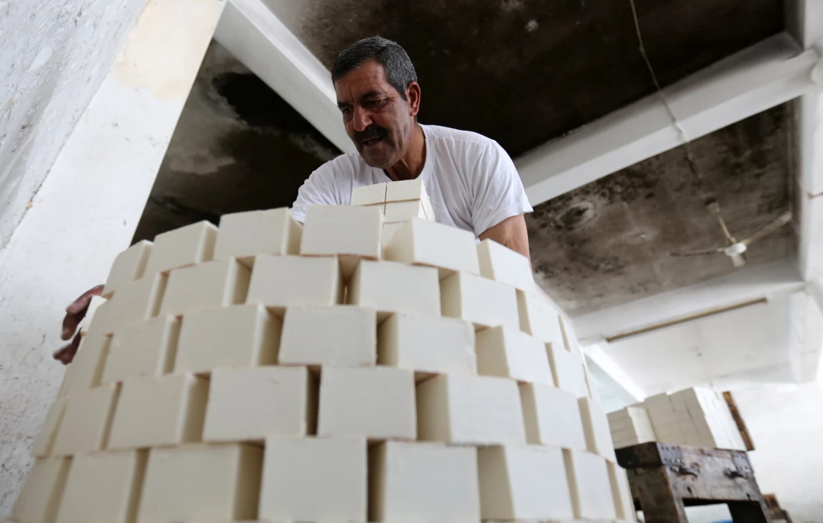 A worker stacks soap bars at the Touqan soap factory in Nablus, West Bank, on March 1.