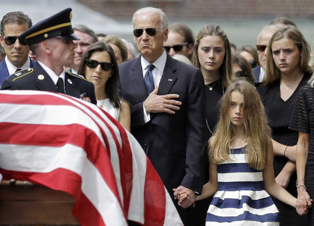 Vice President Biden and his family watch an honor guard carry the casket of Beau Biden into St. Anthony of Padua Roman Catholic Church in Wilmington, Del., on June 6, 2015.