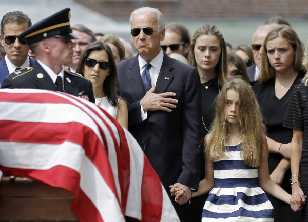Vice President Biden and his family watch an honor guard carry the casket of Beau Biden into St. Anthony of Padua Roman Catholic Church in Wilmington, Del., on June 6, 2015.
