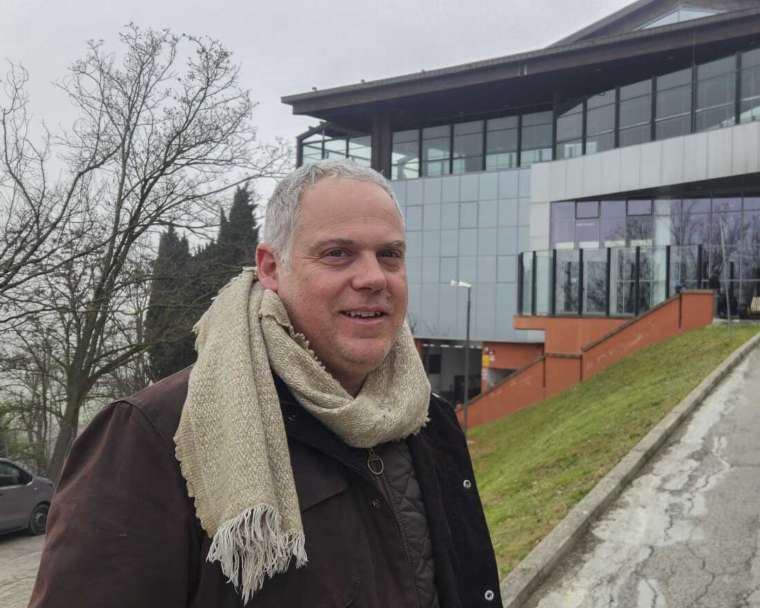 Matteo Diotalevi stands outside the modern dining hall which sits at the center of San Patrignano, where he has worked for fifteen years. Many of the 850 people who live in the addiction treatment community gather here daily for shared meals. "We help people find another chance," Diotalevi said.