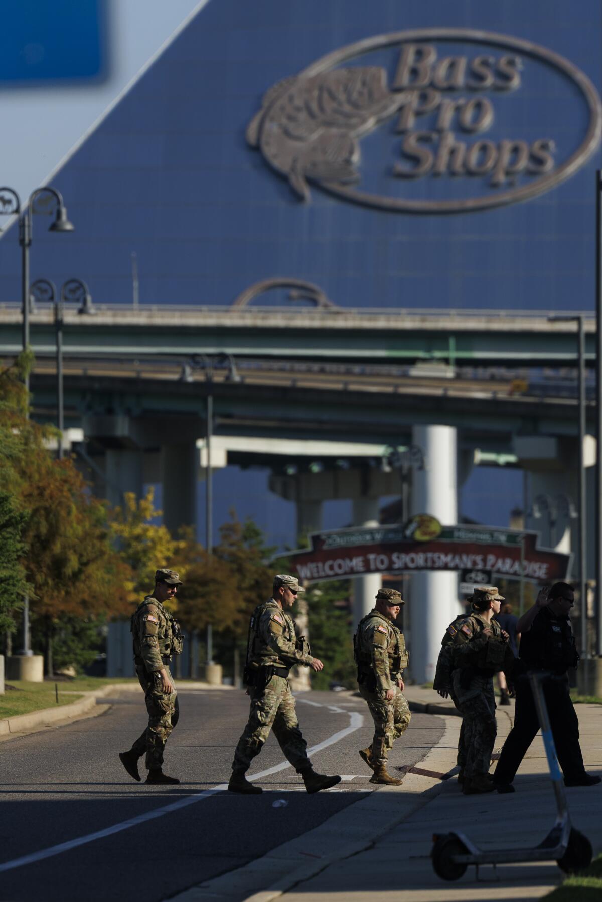 Members of the National Guard patrol outside Bass Pro Shops on Oct. 11, 2025, in Memphis, Tenn.