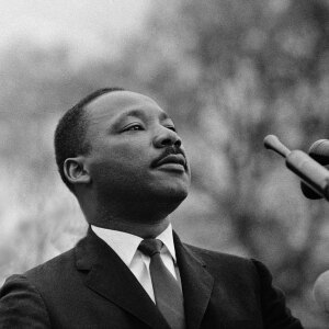 MONTGOMERY, AL - MARCH 25: Dr Martin Luther King Jr speaking before crowd of 25,000 Selma To Montgomery, Alabama civil rights marchers, in front of Montgomery, Alabama state capital building. On March 25, 1965 in Montgomery, Alabama.