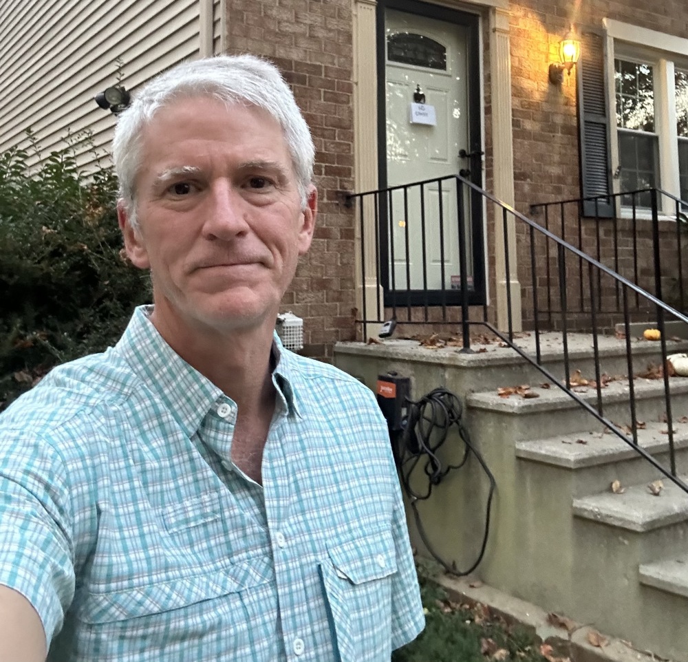Bob Nicholson stands in front of the townhouse in Burke, Va., he sold last year because he and his wife were moving abroad. Back in the U.S. sooner than they expected, Nicholson now regrets selling the home.