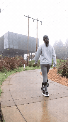 Chloe Veltman walks outside wearing the Nike Amplify system at the Nike campus in Beaverton, Oregon.
