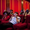 Former President Barack Obama and first lady Michelle Obama wear 3-D glasses during a Super Bowl party in the White House Family Theater in 2009.