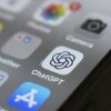 The ChatGPT app icon is seen on a smartphone screen, among other app icons.