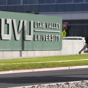 Meagan Bradley walks to a memorial for Charlie Kirk at Utah Valley University in Orem, Utah, Friday, Sept. 12, 2025. (AP Photo/Lindsey Wasson)