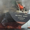A handout photo taken on March 11, 2026 and released by the Royal Thai Navy shows smoke rising from the Thai bulk carrier 'Mayuree Naree' near the Strait of Hormuz after an attack.