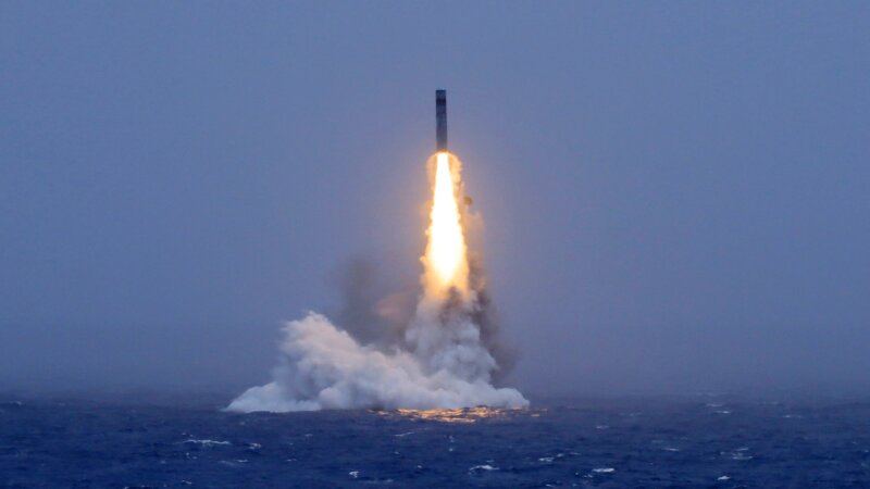 In this photo released by Xinhua News Agency, a long-range ballistic missile bursts out of the sea during a test launched from a Chinese nuclear-powered submarines in the South Pacific on Monday.