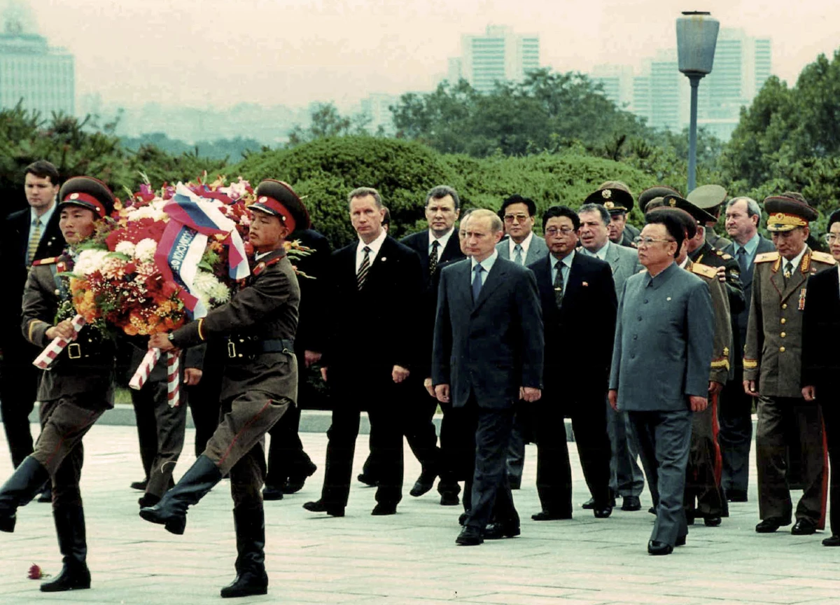 Russian President Vladimir Putin is seen with North Korea's then-leader Kim Jong Il at the Freedom Memorial Tower in Pyongyang, North Korea, on July 20, 2000.