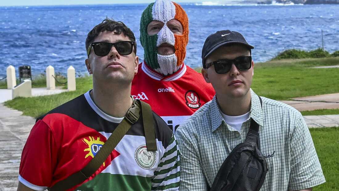 Moglai Bap (left), DJ Provai (middle) and Mo Chara (right), members of Irish band Kneecap, pose for a photo at the National Hotel in Havana, on March 20, 2026.