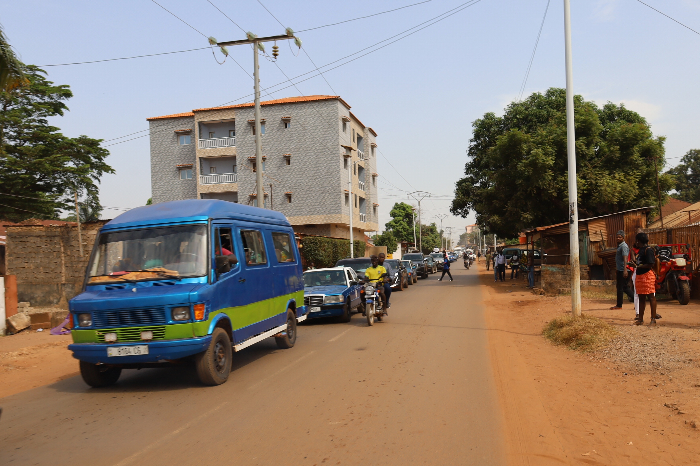 Cars drive on the street in Bissau, Guinea-Bissau, Wednesday.