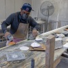 Sun Valley, CA: A stone countertop fabricator wears a mask to help protect against airborne particles which can contribute to silicosis at a shop in Sun Valley, CA. (Brian van der Brug / Los Angeles Times via Getty Images)
