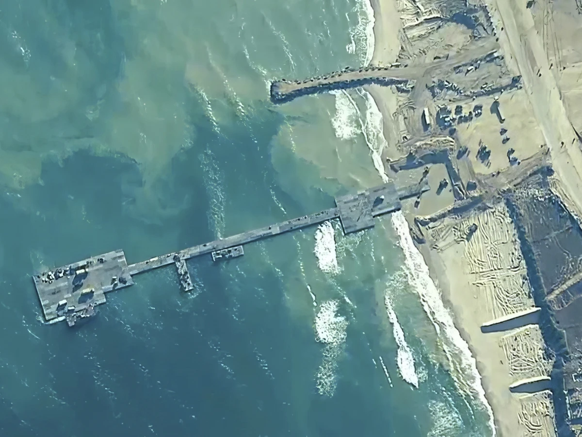 This file image provided by U.S, Central Command, shows U.S. Army soldiers assigned to the 7th Transportation Brigade (Expeditionary), U.S. Navy sailors assigned to Amphibious Construction Battalion 1, and Israel Defense Forces placing the Trident Pier on the coast of Gaza Strip on May 16, 2024.