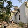 The back of Air India Flight 171 juts out of a building after the Boeing 787-8 Dreamliner crashed in a residential area near the airport in Ahmedabad on Thursday.