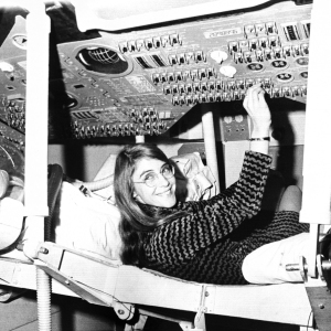 Margaret Hamilton sits in mock-up of Apollo the command module on display at MIT in 1969.