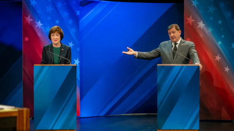 Image 40: Democratic U.S. Senate candidate Troy Jackson gestures toward Republican U.S. Sen. Susan Collins of Maine at Maine Public's Your Vote 2026 debate at the Gracie Theater in Bangor on Thursday, Oct. 15, 2026.