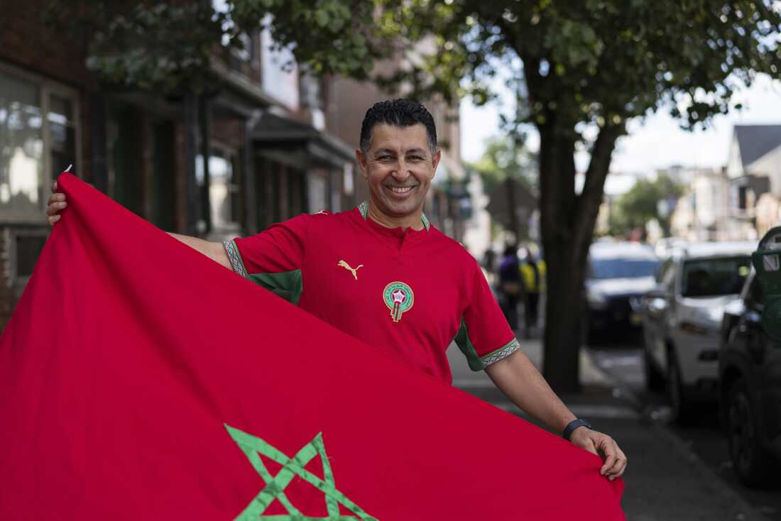 Mustapha Chliah, a Morocco supporter, poses for a portrait holding a Moroccan flag before the Brazil vs. Morocco FIFA World Cup 2026 group-stage match in Paterson, N.J., on June 13.