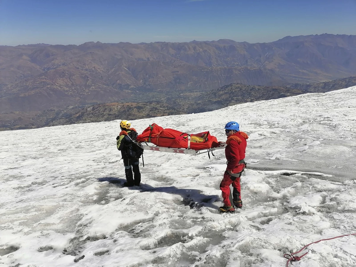 Police carry a body that they identify as U.S. mountain climber Bill Stampfl on Huascaran mountain in Huaraz, Peru, on Friday. Peruvian authorities said they found the mummified body of Stampfl, who died 22 years ago along with two other American climbers after they were trapped in an avalanche while trying to climb Peru's highest peak.