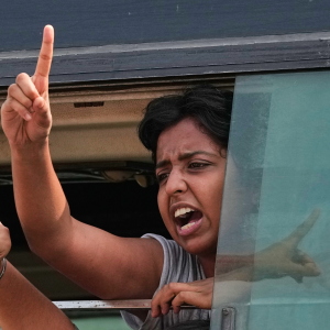 A protester shout slogans as they are detained and taken in a police vehicle during a protest demanding the resignation of Chief Election Commissioner Gyanesh Kumar in New Delhi, India, Saturday, Oct. 10, 2026.