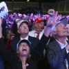 Supporters watch returns at a campaign election night watch party for Donald Trump at the Palm Beach Convention Center in Florida.