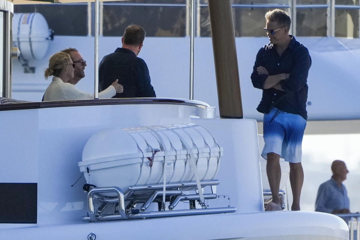 Lachlan Murdoch, right, with his wife Sarah and others as they watch a sailing regatta in Sydney, Australia in February.