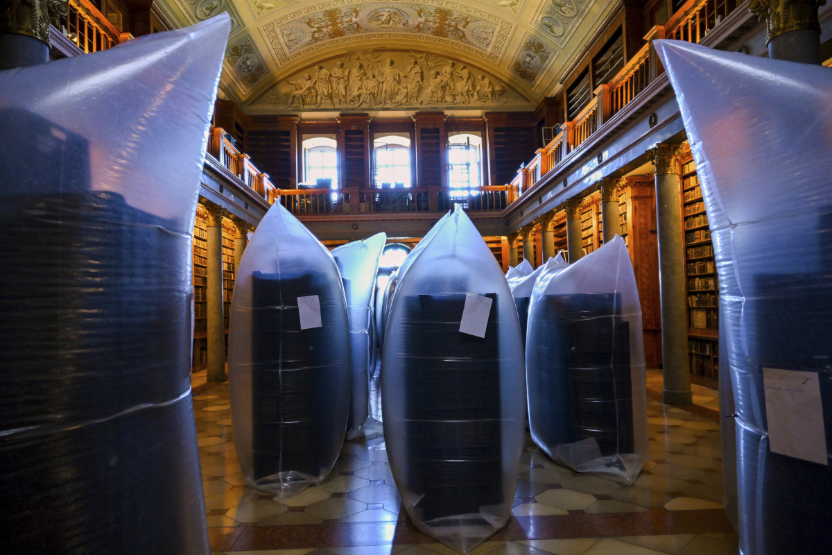 This photo provided by Pannonhalma Archabbey shows books kept in hermetically sealed plastic sacks for disinfection at the Pannonhalma Archabbey's library in Pannonhalma, Hungary on July 3 as a beetle infestation threatens its ancient collection.