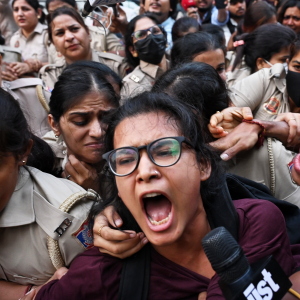 Prominent student leader Neha Bora, center, shouts slogans as she is detained by the police during a youth demonstration demanding the resignation of the country's election chief Gyanesh Kumar, in New Delhi, India, Friday, Oct. 16, 2026.