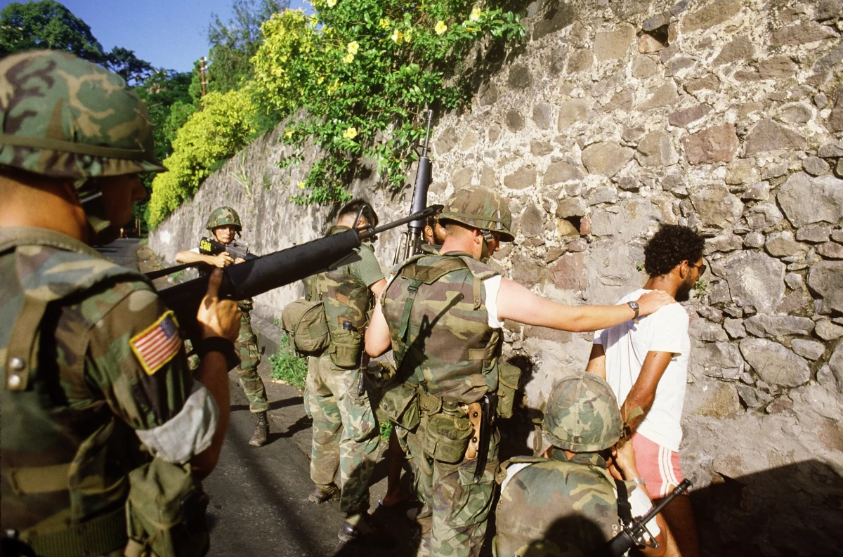 U.S. soldiers arrest suspected Marxist activist in St. George's, the capital of the Grenada Island, on Oct. 30, 1983, three days after American forces invaded the island, ousting the Marxist government.