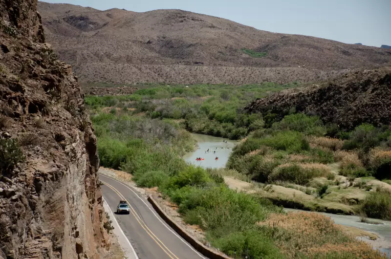 A group kayaks down the Rio Grande as it courses through the Big Bend. River guides and local outfitters worry a wall would cut off their access to the Rio Grande and devastate their livelihoods.
