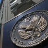 The seal of the Department of Veterans Affairs is seen outside the agency's building in Washington, D.C. The VA says it will no longer offer medical treatment for gender dysphoria to veterans.