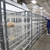 Customers check mostly empty bread shelves at a shopping warehouse in Kissimmee, Fla., on Sunday.