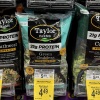 Falling grocery prices helped to keep inflation in check last month. Lettuce prices dropped sharply in July after an outbreak of food-borne illness prompted a recall of some leafy greens.