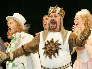 Tim Curry sings during the opening night curtain call for <em>Monty Python's Spamalot</em> in March 2005 in New York City.
