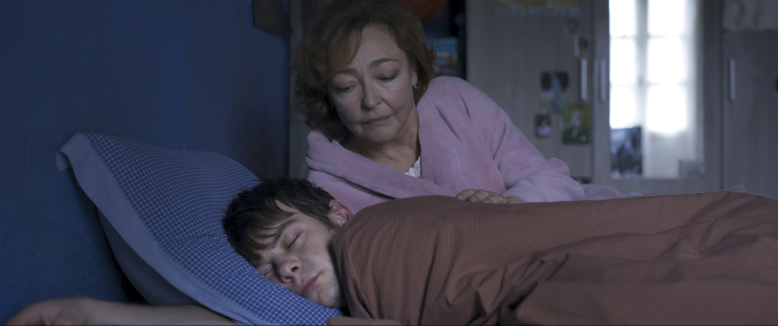 Jérémie (Félix Kysyl) stays with the newly widowed Martine (Catherine Frot) in the French thriller <em>Misericordia</em>.