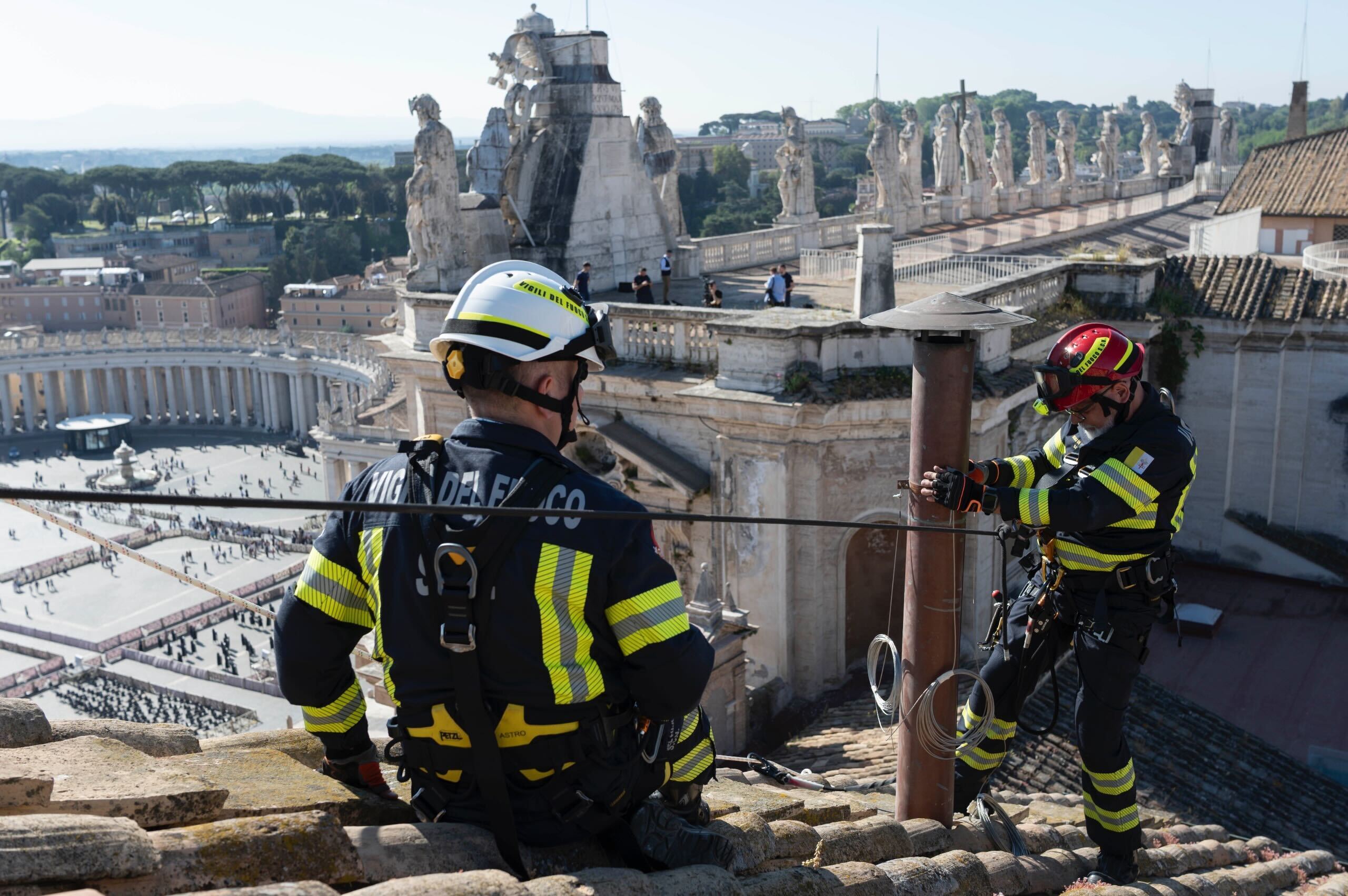 Workers have completed the installation of the chimney on top of the Vatican building in Rome, Italy. The color of the chimney smoke will give hints to the public about how the papal selection process is going.