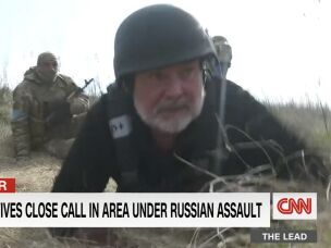 CNN's Ben Wedeman ducks for cover while reporting in Ukraine in 2022.