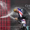Mercedes driver Lewis Hamilton, right, celebrates on the podium after winning the British Formula One Grand Prix race at the Silverstone racetrack in Silverstone, England, on Sunday.