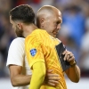 Coach Gregg Berhalter of the United States greets goalkeeper Matt Turner after losing 0-1 against Uruguay at the end of a Copa America Group C soccer match in Kansas City, Mo., on Monday.