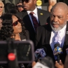 Rodney Wells, right, stepfather of Tyre Nichols, speaks during a news conference with his wife RowVaughn Wells, center, and attorney Ben Crump, left, outside the federal courthouse Thursday after three former Memphis police officers were convicted of witness tampering charges in the 2023 fatal beating of their son in Memphis, Tenn.