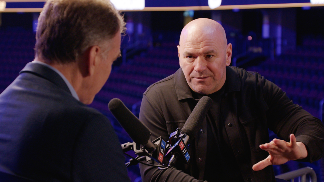 Dana White sits at an NPR mic and speaks to NPR's Steve Inskeep for a Newsmakers interview.