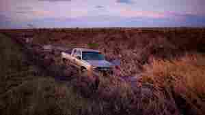A truck sits in still water after Hurricane Laura swept through Cameron Parish, La., in 2020. The storm killed dozens of people in the U.S.