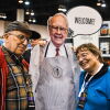 Shareholders pose with a lifesize cardboard cutout of Warren Buffett in 2022, during Berkshire Hathaway's annual shareholders meeting in Omaha, Nebraska.
