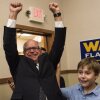 Tim Walz has been praised online by supporters for his folksy, midwestern demeanor. Here, Walz and his son, Gus, celebrate while entering his election night party on Aug. 14, 2018 in St Paul, Minnesota.