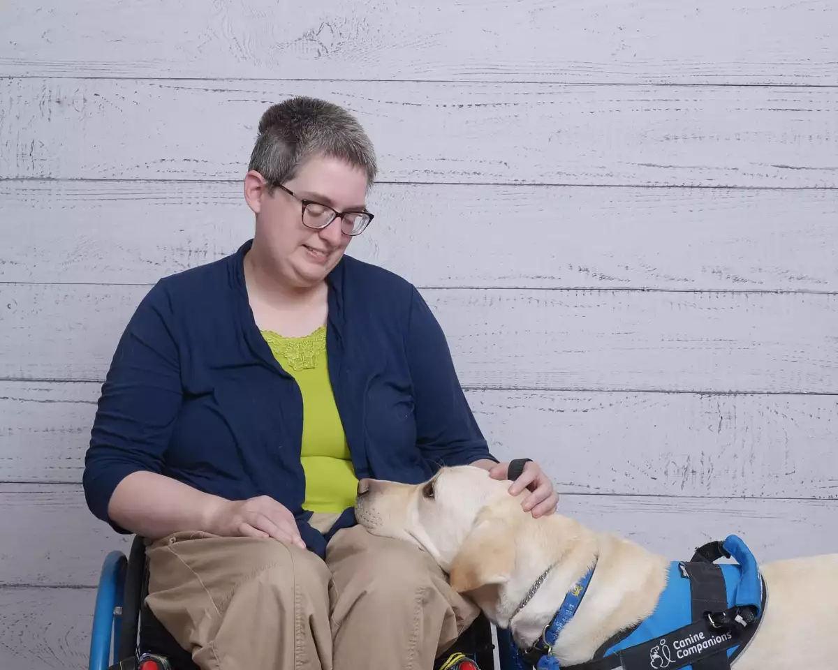 Sometimes, hotels charge Lohr a pet fee for her service dog, Milo, even though that's not allowed by law.