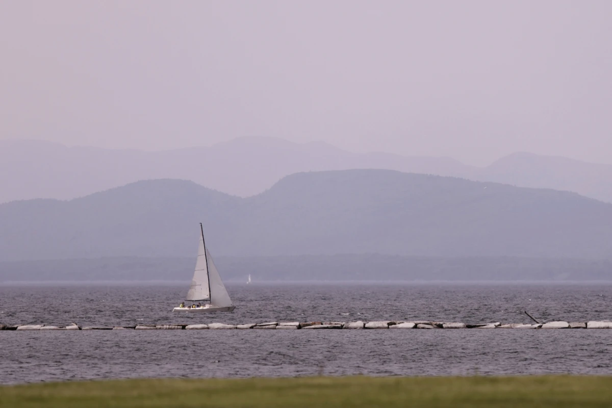 Hazy skies due to smoke from wildfires in Canada are seen over Lake Champlain and the Adirondack Mountains on Wednesday in Burlington, Vt.