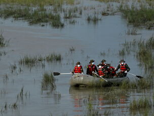 Army personnel conduct a search and rescue operation for flood victims along the Narayani river at Bharatpur in Nepal's Chitwan district on Sunday.