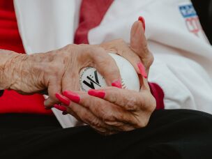Maybelle Blair, a veteran of the All-American Girls Professional Baseball League, a professional women's baseball league that was founded in 1943 and ran for 12 seasons, grips a baseball prior to throwing out the first pitch at the WPBL's inaugural game in Springfield, Ill., on Saturday, Aug. 1.